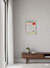 Small 2026 Hindi calendar on wall, red date blocks and green grid