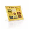 Gold Navgrah yantra plaque with square grid and inscriptions, on clear stand