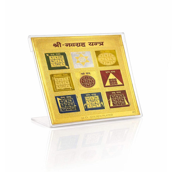 Gold Navgrah yantra plaque with square grid and inscriptions, on clear stand