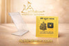 Gold yantra plaque standing in a clear acrylic display stand