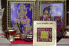 Golden yantra box with red grid symbols placed among altar items