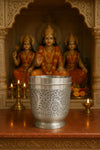 Silver engraved glass cup with floral motif, wide rim and pedestal base