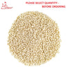 White sesame seeds in a heap, off-white kernels