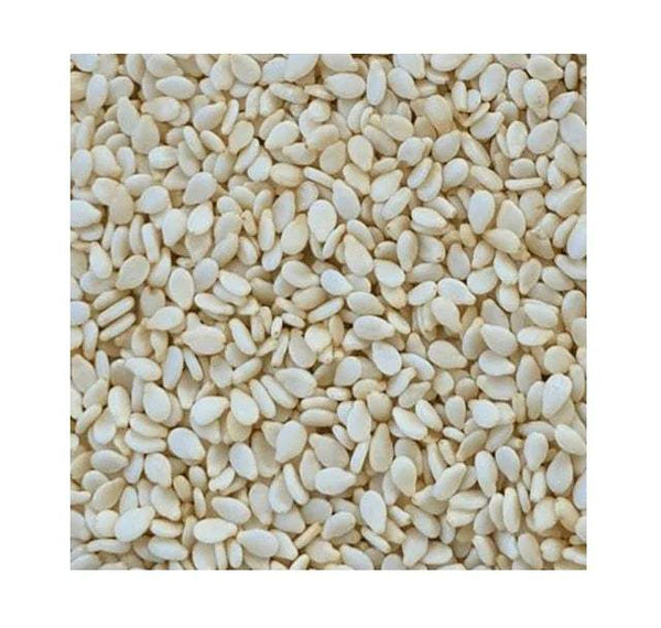 Close-up of off-white sesame seeds, oval kernels