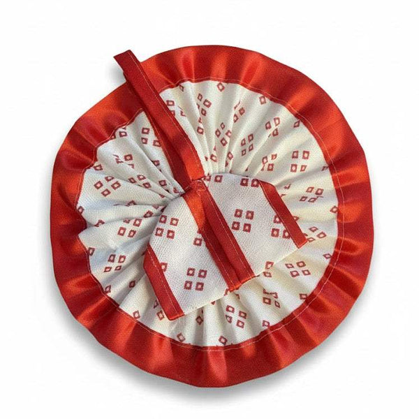Krishna dress with red satin outer, white patterned rosette and ribbon center