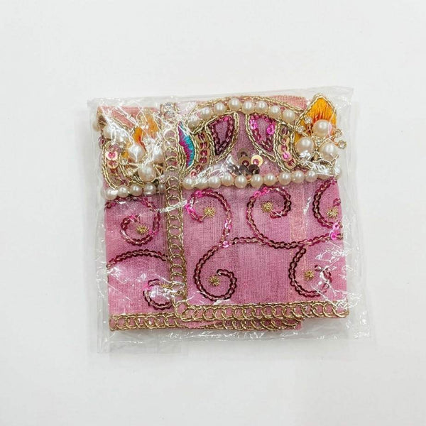 Decorative chunri cloth in pink-purple with gold trim, pearl strands, and embroidered motifs