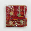 Red chunri with gold trim, green flower ornaments and layered patterned bands