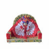 Krishna dress with red satin outer, white patterned rosette and arched embellished base
