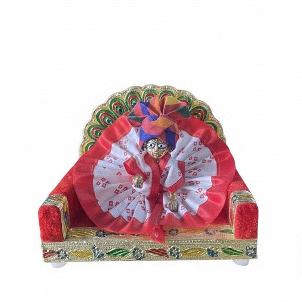 Krishna dress with red satin outer, white patterned rosette and arched embellished base
