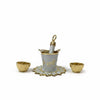 Holi festival plate set: gray pichkari bucket with gold base and two small bowls