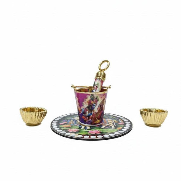 Krishna printed plate with matching pichkari bucket and two gold bowls