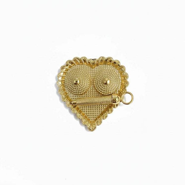 Heart-shaped gold jeweled charm with loop and eye details