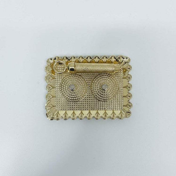 Gold-tone rectangular decorative pichkari accessory with ornate border and circular motifs