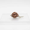 Brown three-faced rudraksha bead with silver-toned clasp and loop
