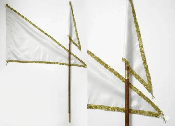 White religious flags with gold edging on wooden poles