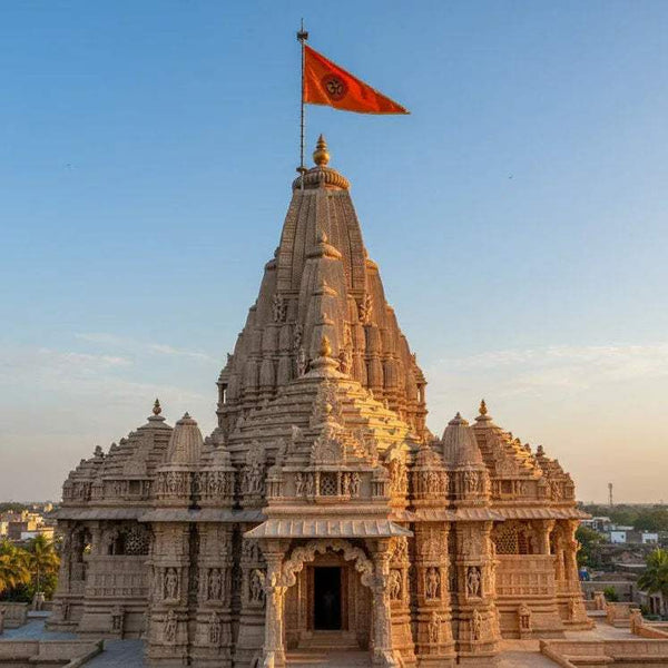 Stone temple with orange OM flag on top of the shrine