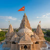Small orange Ganesha flags on temple spires
