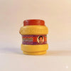 Chandan powder jar with red lid and yellow body, purple label facing forward