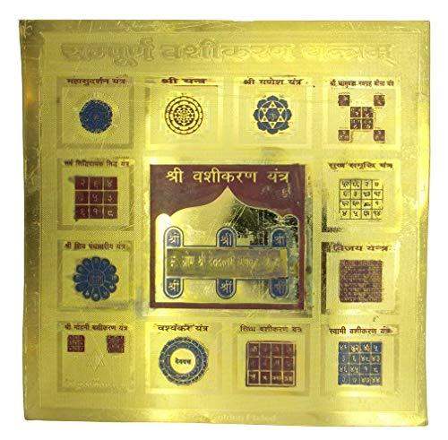Golden plated Vashikaran yantra plate with ornate border and central deity panel
