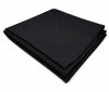 Black wool meditation mat, neatly folded with clean stitched border