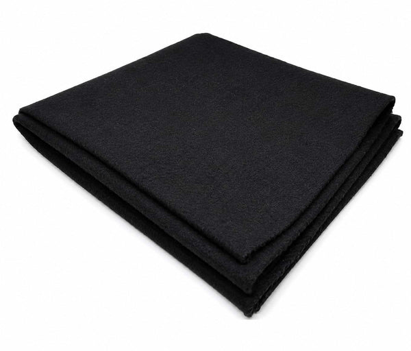Black wool meditation mat, neatly folded with clean stitched border