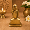Golden Sai Baba idol statue, back view with raised head and robe detailing