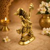 Golden Hanuman idol standing, raised mace and hands holding a mountain