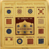 Golden plated yantra board with central dark panel, circular emblems, and grid charts