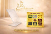 Gold yantra plaque with nine colored symbols on a clear acrylic display stand