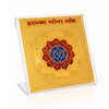Gold square yantra card with red-and-blue circular emblem in a clear stand