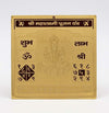 Gold yantra card with central deity illustration, om symbol, and script blocks