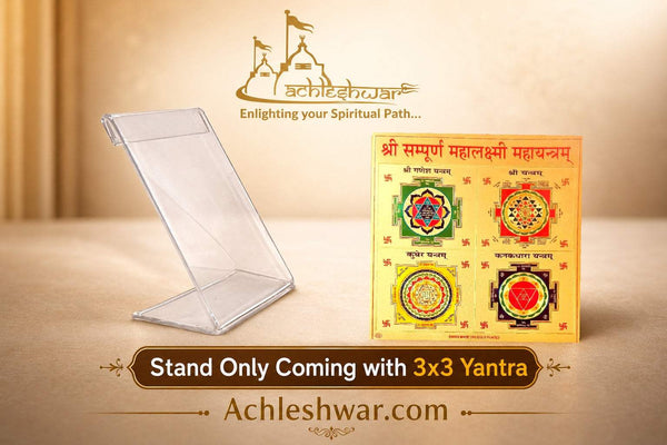 Clear acrylic stand holding an orange yantra chart card on beige surface