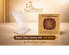 Baglamukhi Yantra on a clear plastic stand, maroon mandala on beige card