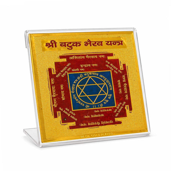 Gold and blue yantra plaque in a clear acrylic display stand
