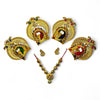 Gold jewelry set with peacock design on a white background