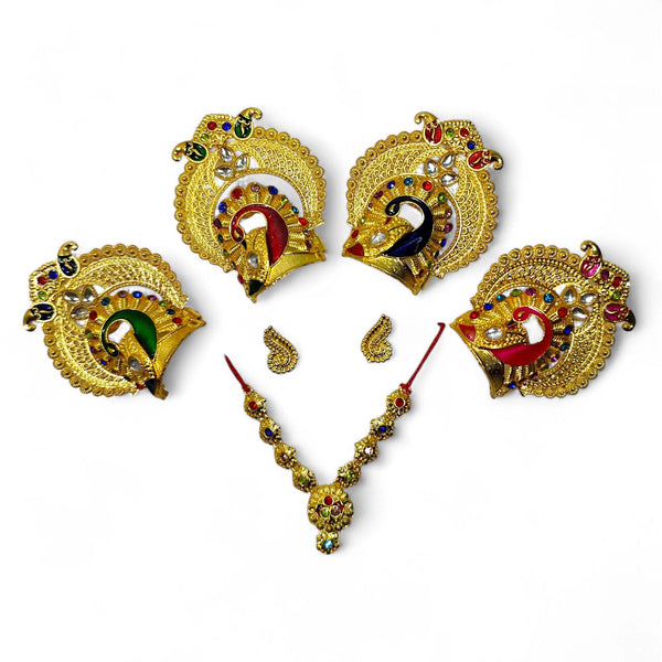Gold jewelry set with peacock design on a white background
