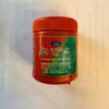 Red kumkum sindur powder jar with ribbed cap, back label and seal visible.