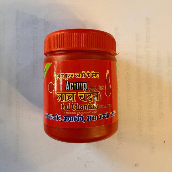 Red chandan powder jar with orange lid and front label