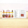 Open Hindi panchang book with printed pages and small deity illustrations