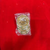 Traditional gold-tone bangles set with green and red accents, in clear packaging