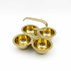 Brass pooja chopda set with four small bowls and a curved handle