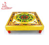 Embroidered square chowki base with gold yellow top cloth and red legs, floral center