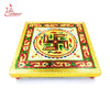 Embroidered square chowki with gold frame and geometric emblem center