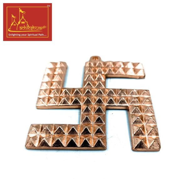 Copper swastik pyramid decoration with stacked pyramid patterns, metal ornament