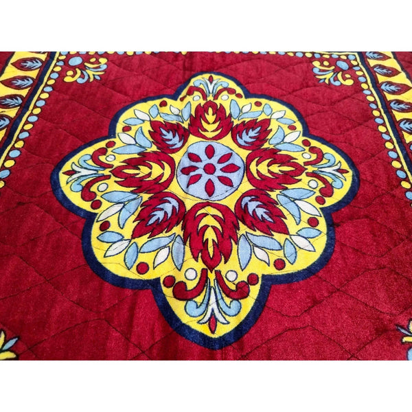 Velvet mandir mat centerpiece medallion in red, blue, cream, and gold with quilted texture