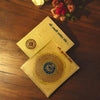 Gold-plated yantra cards with intricate circular geometric symbols