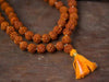 Rudraksh bead mala necklace with yellow tassel and round bead strands