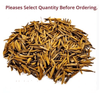 Large pile of dried golden-brown plant stems and leaf-like pieces