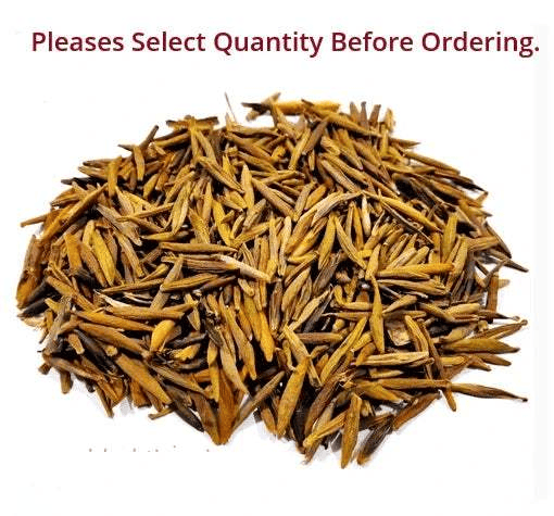 Large pile of dried golden-brown plant stems and leaf-like pieces