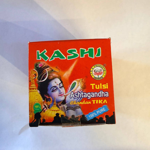 Kashi Ashtagandha Chandan Tika powder box, orange front with deity artwork
